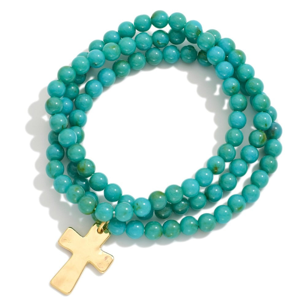 Set Of Three Beaded Stretch Bracelets With Hammered Metal Cross Charm
