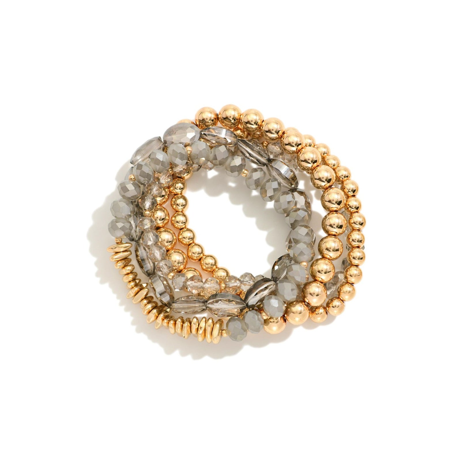 Set of gold and gray beaded bracelets on a white background