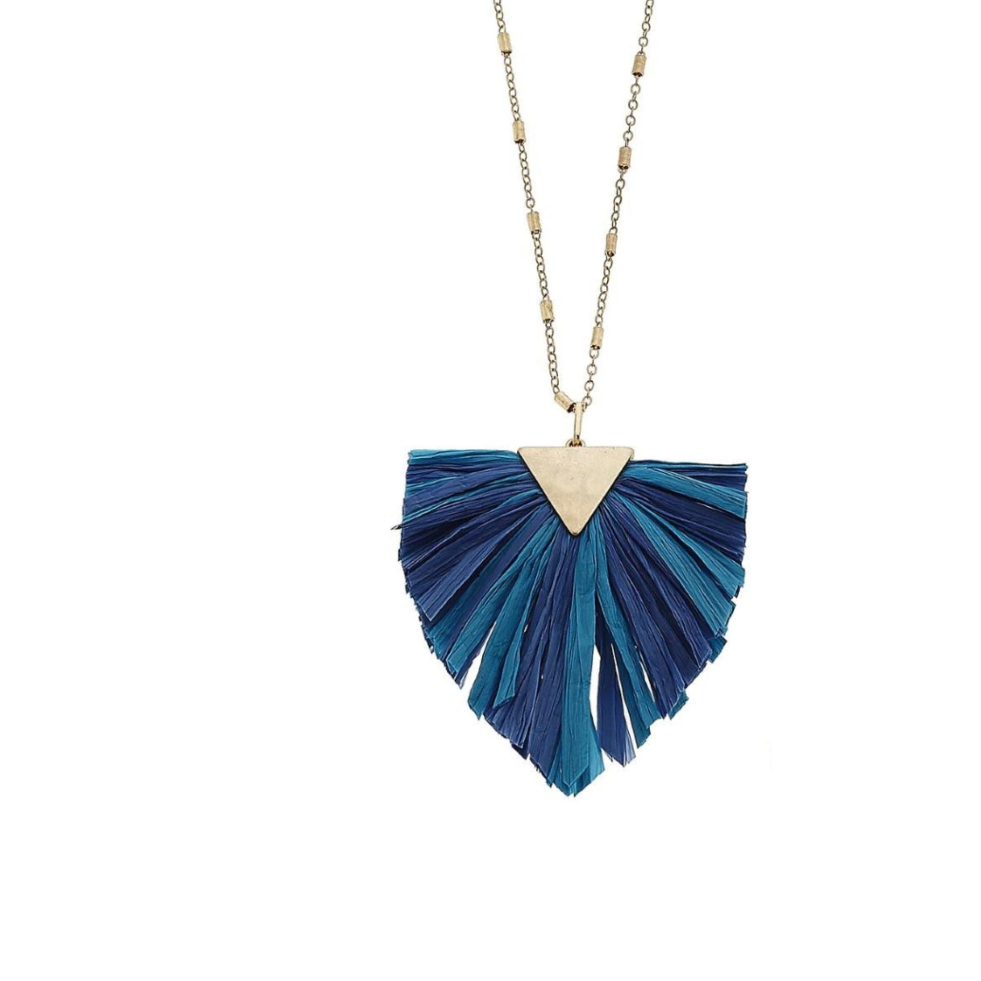 Long metal necklace featuring a raffia tassel pendant with gold accents