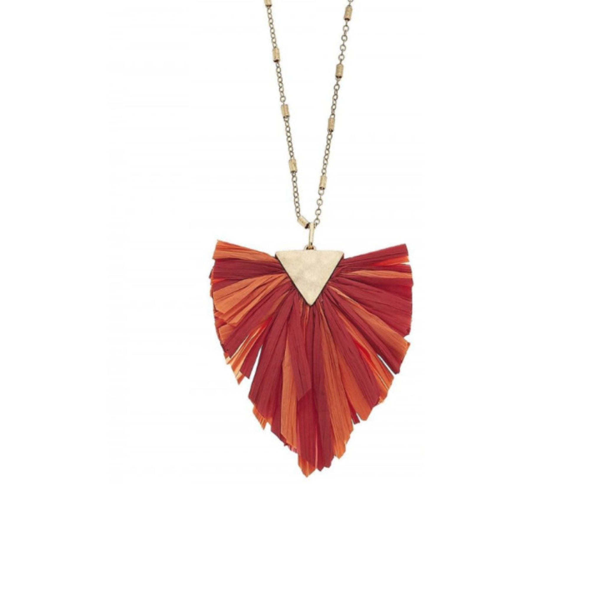 Long metal necklace featuring a raffia tassel pendant with gold accents