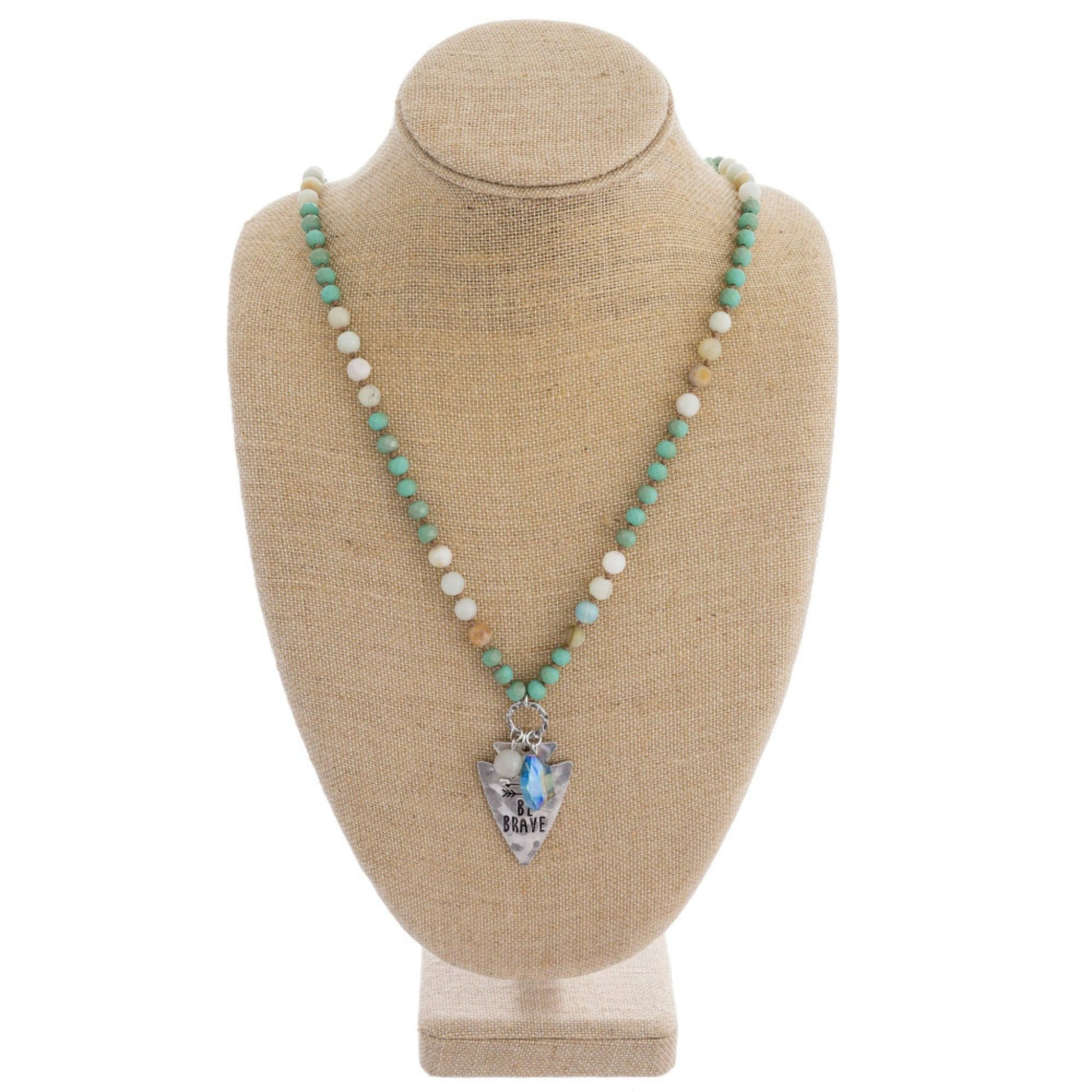 Long beaded necklace with engraved message, "Be brave."