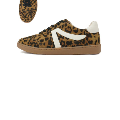 Leopard print sneaker with white accents on a white background