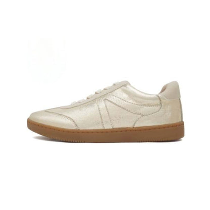 A metallic gold lace-up sneaker with a textured rubber sole.
